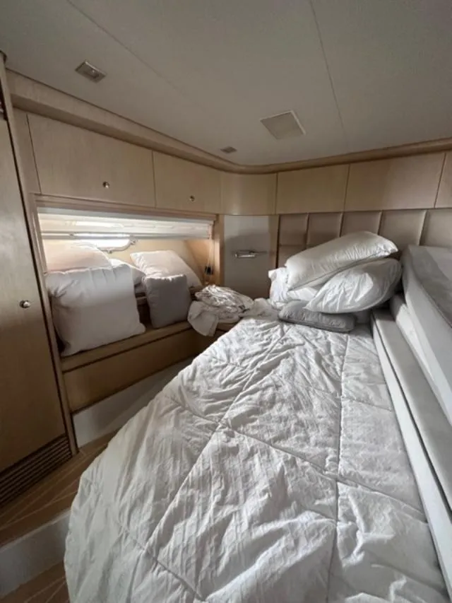 Slide: The Image of Luxurious bedroom interior of 2006 Baia 63 Azzurra yacht with cozy bedding. - 18