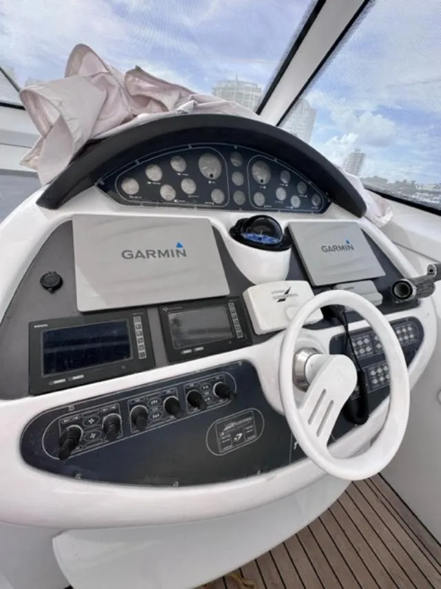 Slide: The Image of 2006 Baia 63 Azzurra yacht helm with Garmin navigation systems. - 6