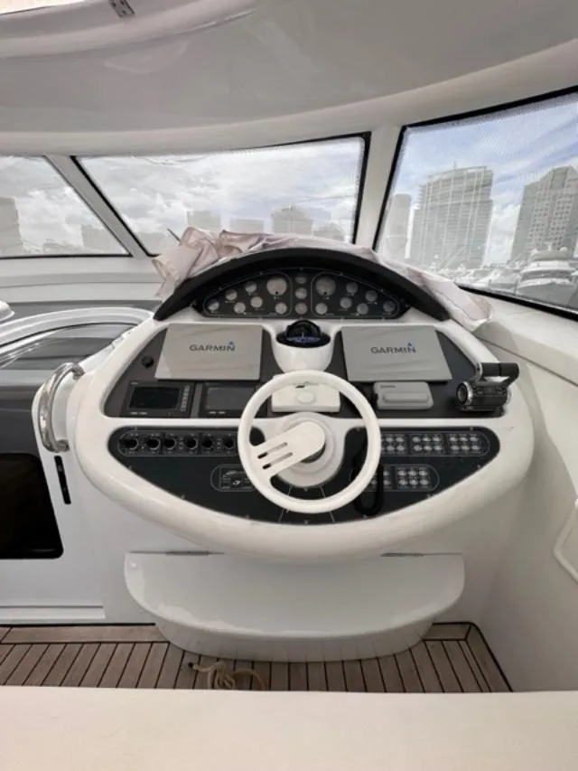 Slide: The Image of 2006 Baia 63 Azzurra yacht helm with Garmin navigation system. - 7