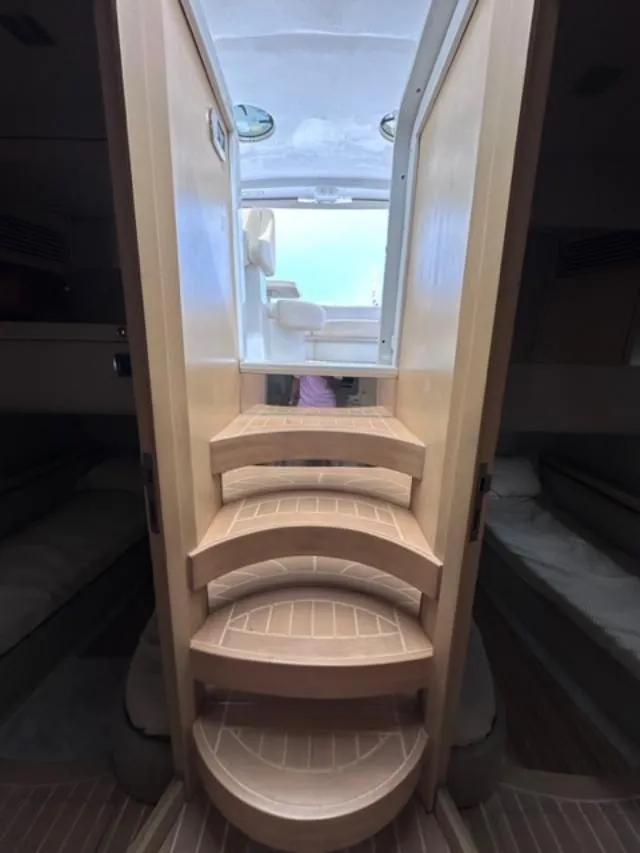 Slide: The Image of Staircase inside 2006 Baia 63 Azzurra yacht leading to deck. - 9