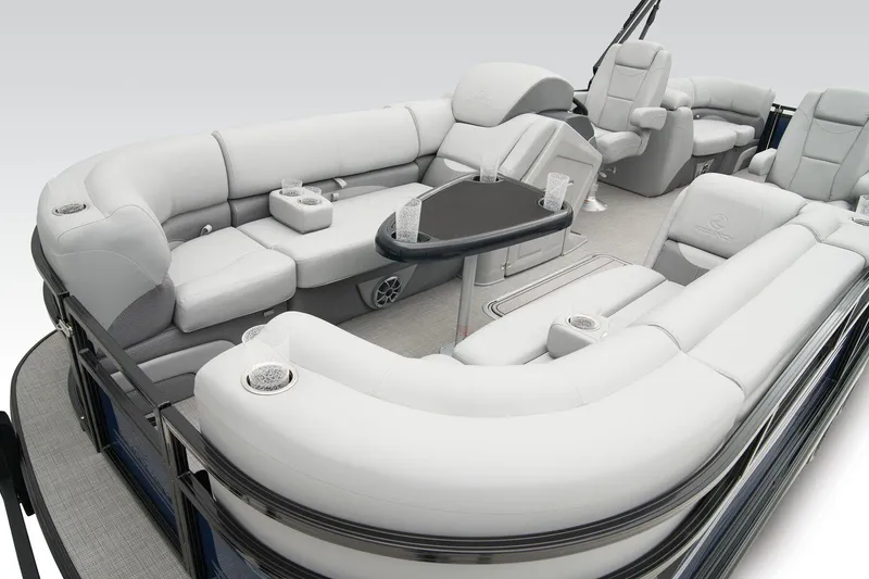 Slide: The Image of 2024 Regency 230 DL3 pontoon boat with luxurious seating and modern amenities. - 12