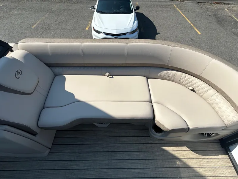 Slide: The Image of 2024 Avalon LSZ 2385 EL boat with beige seating and sun deck. - 12