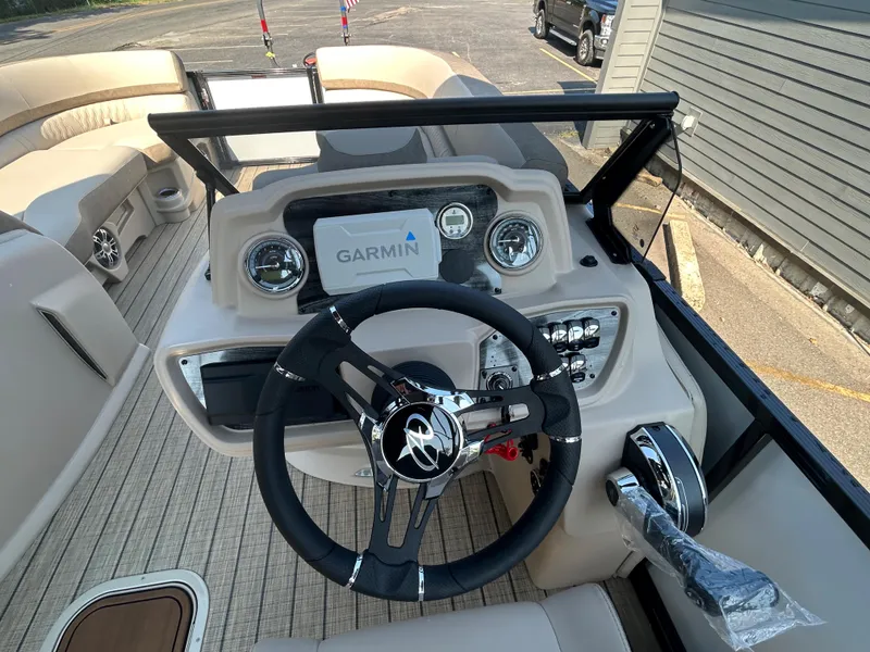 Slide: The Image of 2024 Avalon LSZ 2385 EL boat dashboard with Garmin navigation system. - 18