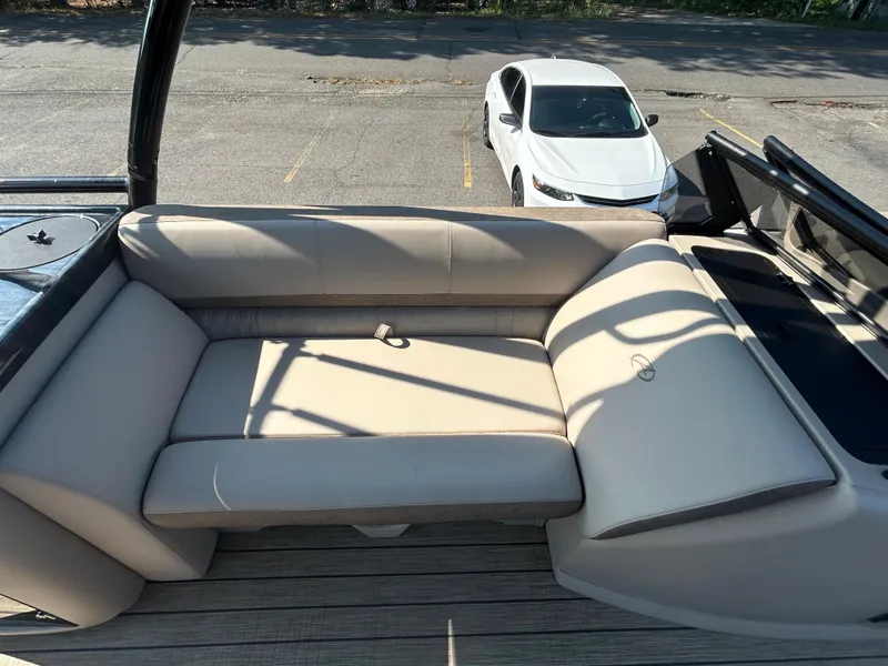 Slide: The Image of 2024 Avalon LSZ 2385 EL boat with beige seating and deck view. - 19