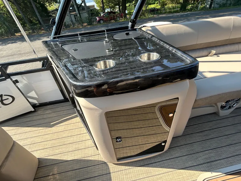 Slide: The Image of 2024 Avalon LSZ 2385 EL boat interior with sleek countertop and cup holders. - 27