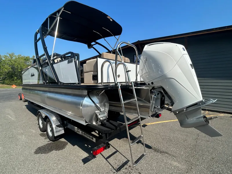 Slide: The Image of 2024 Avalon LSZ 2385 EL pontoon boat with outboard motor and trailer. - 4