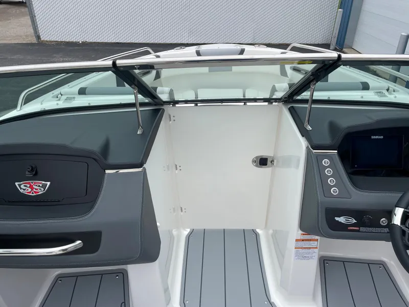 Slide: The Image of 2024 Chaparral 247 SSX boat interior with dashboard and steering wheel. - 14