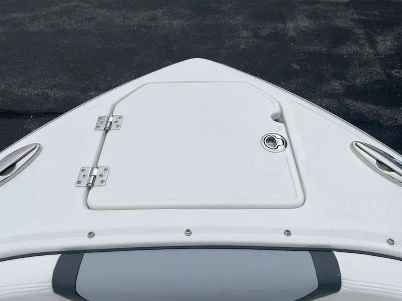 Slide: The Image of 2024 Chaparral 247 SSX boat bow with storage compartment. - 23