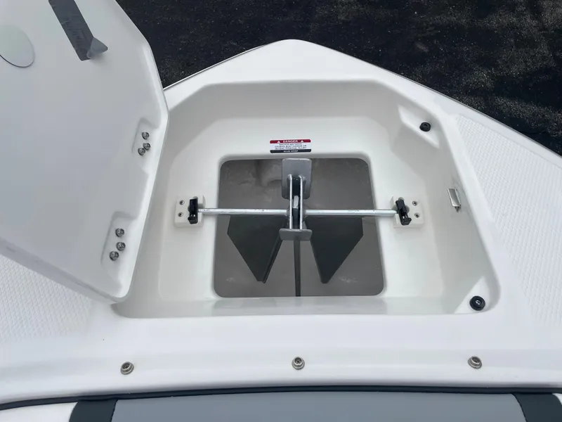 Slide: The Image of 2024 Chaparral 247 SSX anchor storage compartment. - 24