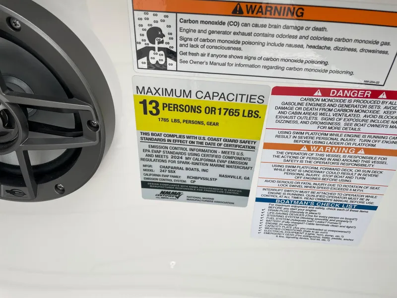 Slide: The Image of 2024 Chaparral 247 SSX boat capacity and safety warning labels. - 31