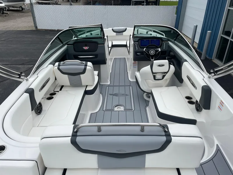 Slide: The Image of 2024 Chaparral 247 SSX boat interior with white and gray seating. - 34