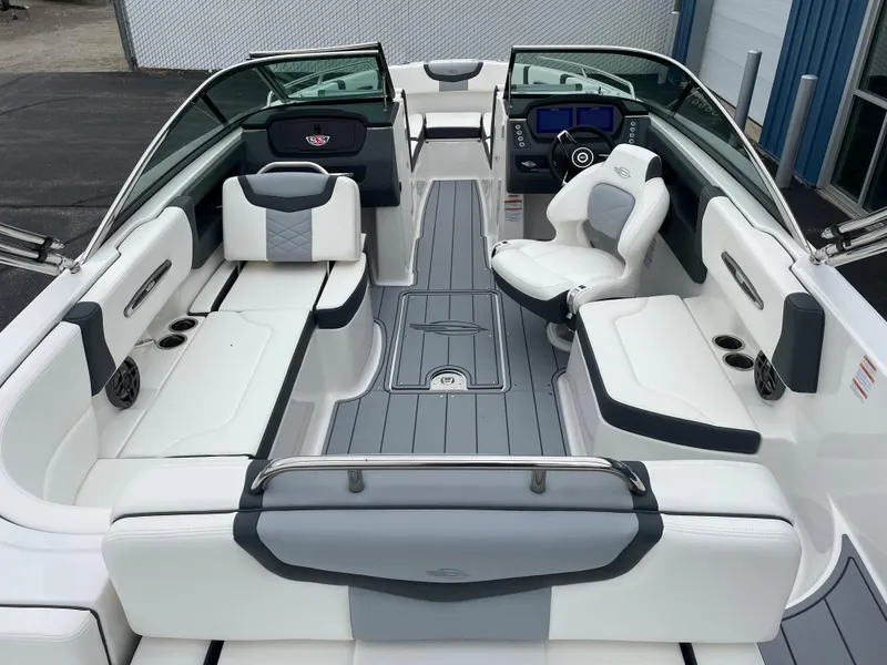 Slide: The Image of 2024 Chaparral 247 SSX boat interior with luxurious seating and modern dashboard. - 35