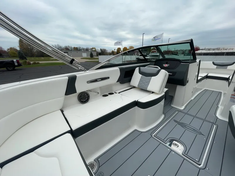 Slide: The Image of 2024 Chaparral 247 SSX boat interior with white and gray seating. - 40