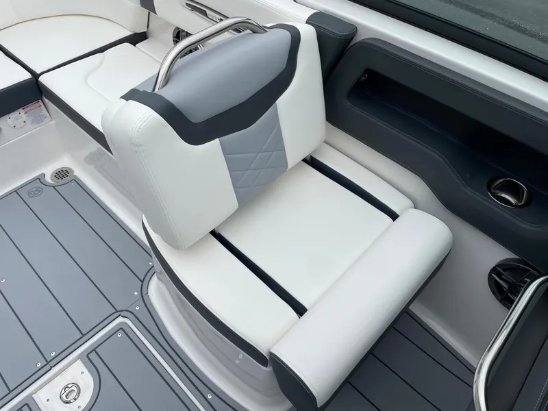 Slide: The Image of 2024 Chaparral 247 SSX boat interior seating with gray and white upholstery. - 42
