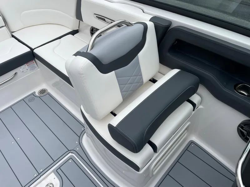 Slide: The Image of 2024 Chaparral 247 SSX boat interior with gray and white seating. - 43