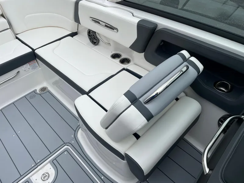 Slide: The Image of 2024 Chaparral 247 SSX boat interior with white and gray seating. - 44