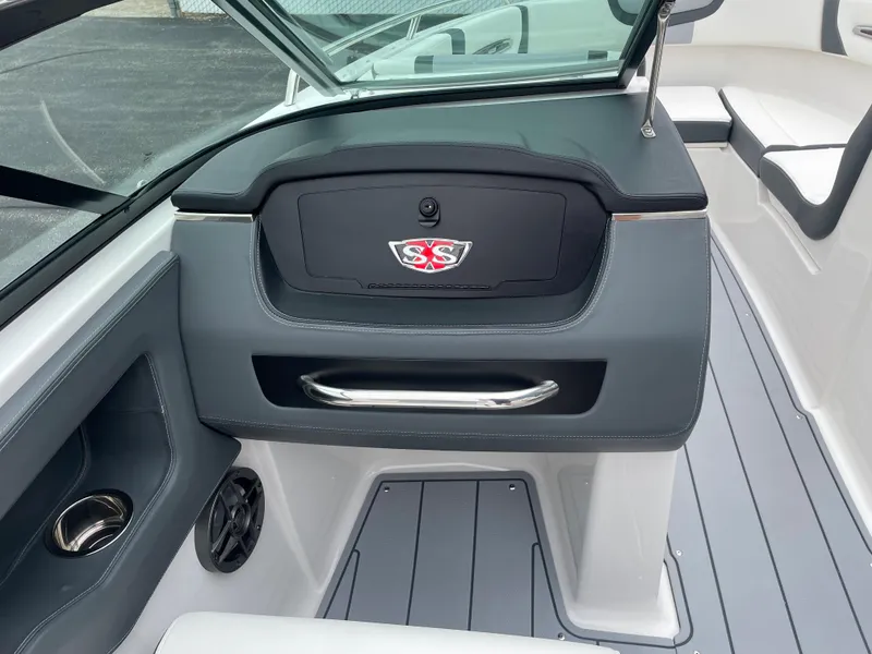 Slide: The Image of 2024 Chaparral 247 SSX boat interior dashboard and seating area. - 45