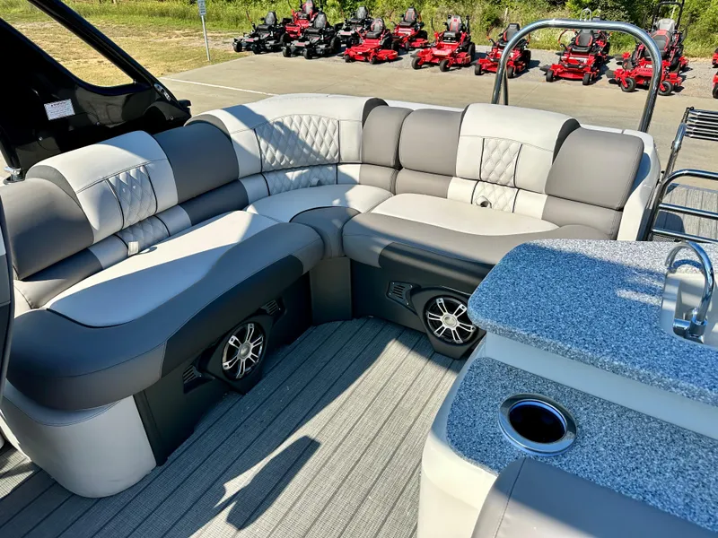 Slide: The Image of 2023 Tahoe Pontoon 27FT Grand Tahoe LTD Elite interior with plush seating and built-in speakers. - 11