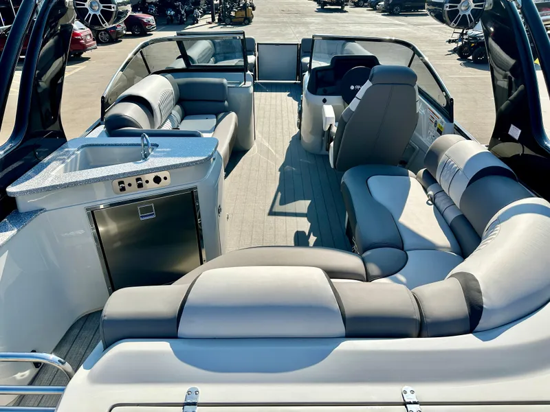 Slide: The Image of 2023 Tahoe Pontoon 27FT Grand Tahoe LTD Elite interior with luxurious seating and kitchenette. - 12