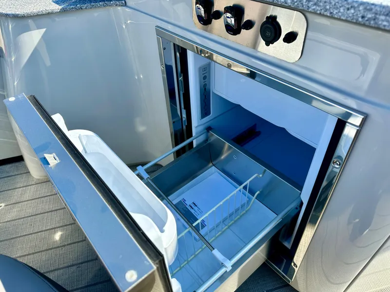 Slide: The Image of 2023 Tahoe Pontoon 27FT Grand Tahoe LTD Elite open refrigerator drawer. - 15