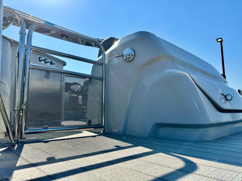 Slide: The Image of 2023 Tahoe Pontoon 27FT Grand Tahoe LTD Elite, sleek design under clear blue sky. - 21