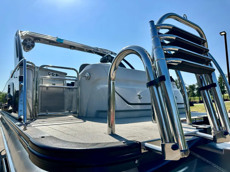 Slide: The Image of 2023 Tahoe Pontoon 27FT Grand Tahoe LTD Elite, rear deck view with ladder and railings. - 22