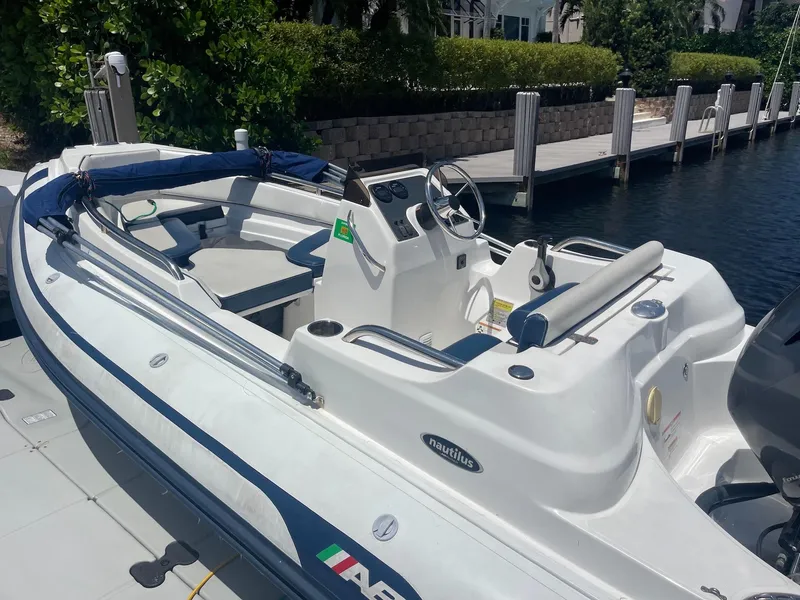 Slide: The Image of 2020 AB Inflatables Nautilus 15 DLX boat docked at marina. - 2