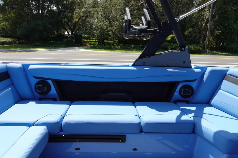 Slide: The Image of 2024 Axis A225 boat with blue interior seating and black accents. - 15