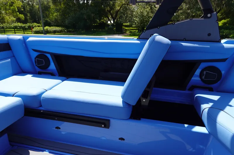 Slide: The Image of 2024 Axis A225 boat interior with blue seating and adjustable backrest. - 16