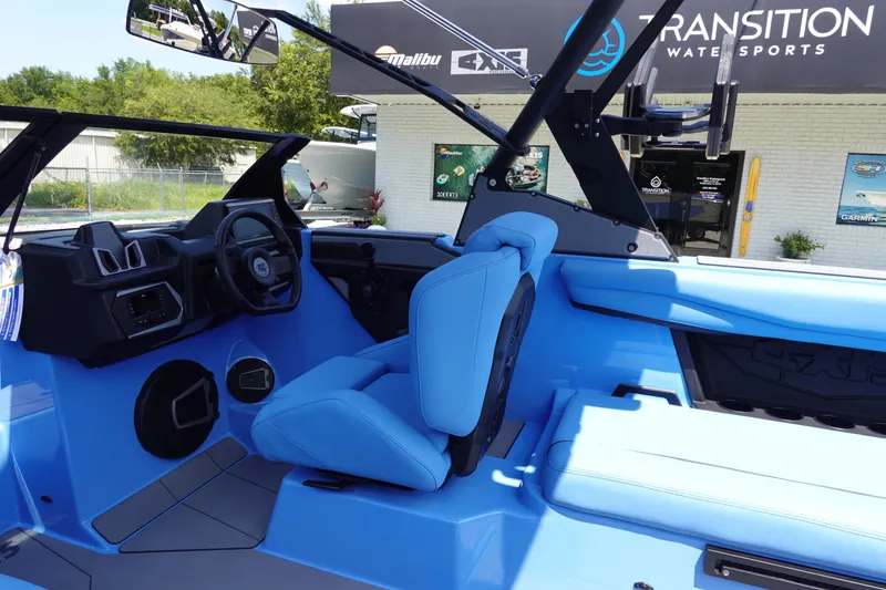 Slide: The Image of 2024 Axis A225 boat interior with blue seating at Transition Water Sports. - 20