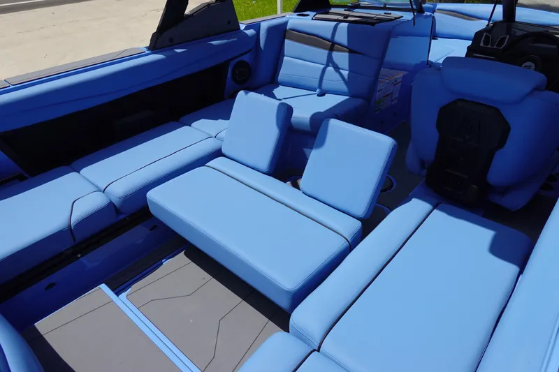 Slide: The Image of 2024 Axis A225 boat interior with blue seating and modern design. - 29