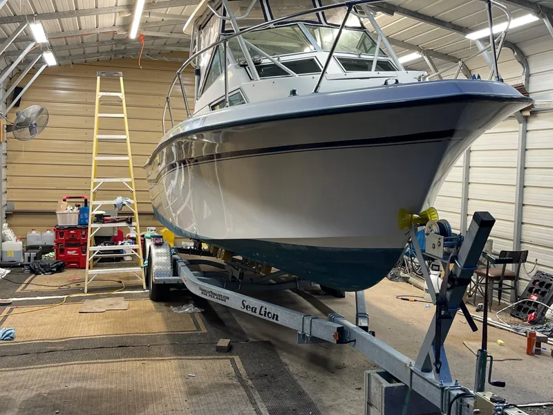 Slide: The Image of 1988 Grady-White Offshore boat on a Sea Lion trailer in a garage. - 6