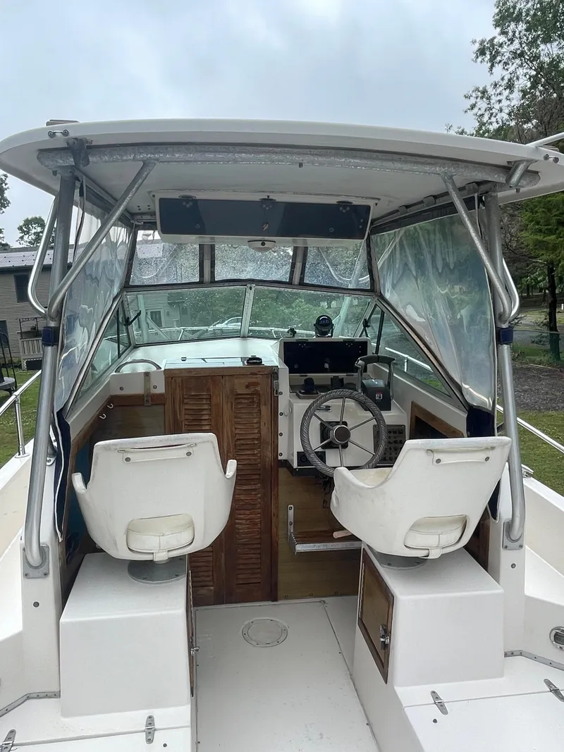 Slide: The Image of 1988 Grady-White Offshore boat interior with helm and seating. - 7
