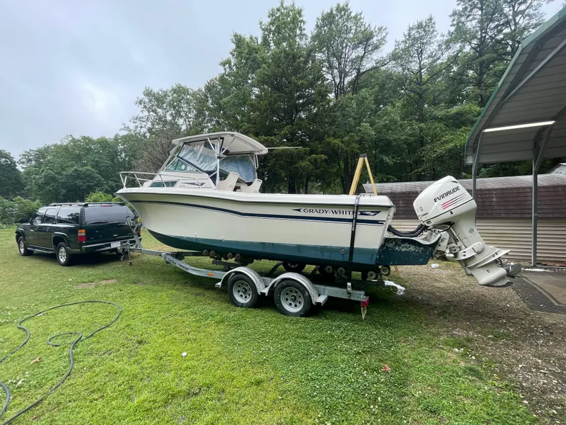 Slide: The Image of 1988 Grady-White Offshore boat on trailer with Evinrude outboard motor. - 10