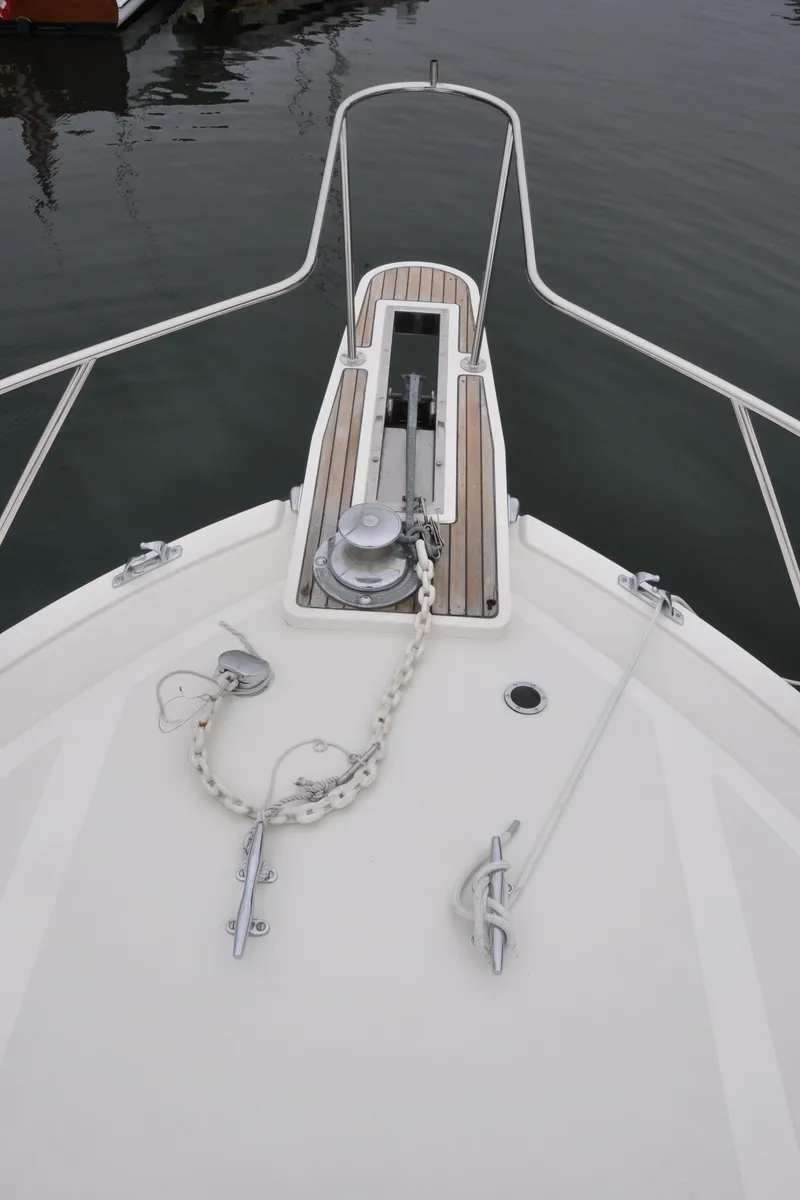 Slide: The Image of Bow of a 1987 Bertram 37 Convertible yacht with anchor chain and windlass. - 19