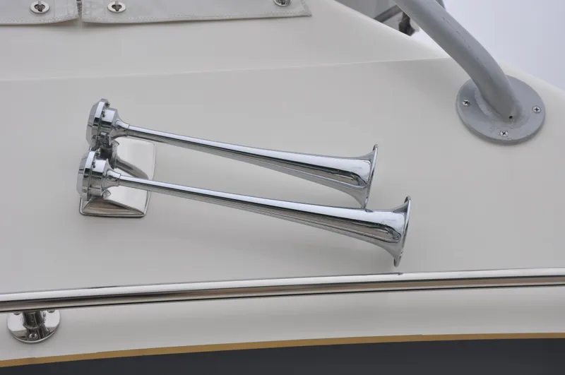 Slide: The Image of Chrome horns on 1987 Bertram 37 Convertible boat deck. - 20