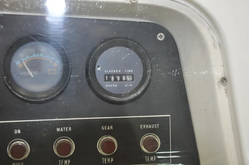 Slide: The Image of Close-up of 1987 Bertram 37 Convertible boat dashboard with gauges and buttons. - 36