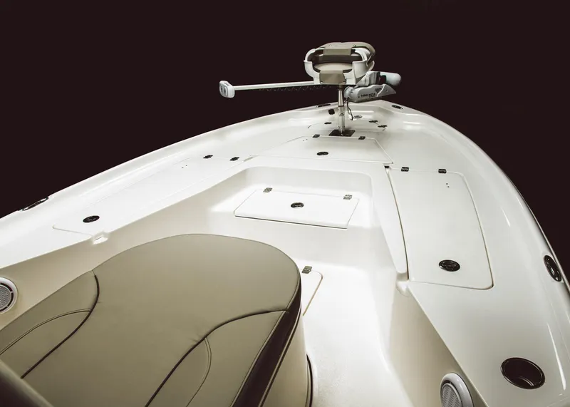 Slide: The Image of 2024 Key West 250 Bay Reef boat interior with seating and storage compartments. - 18