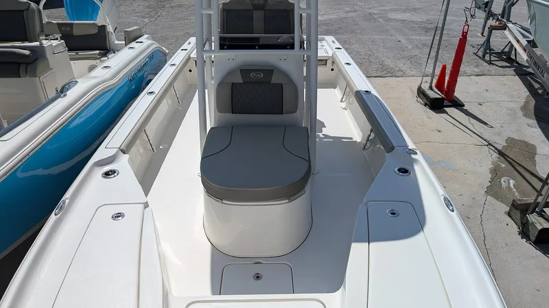 Slide: The Image of 2025 Key West 250 Bay Reef boat, white deck, center console, docked outdoors. - 7