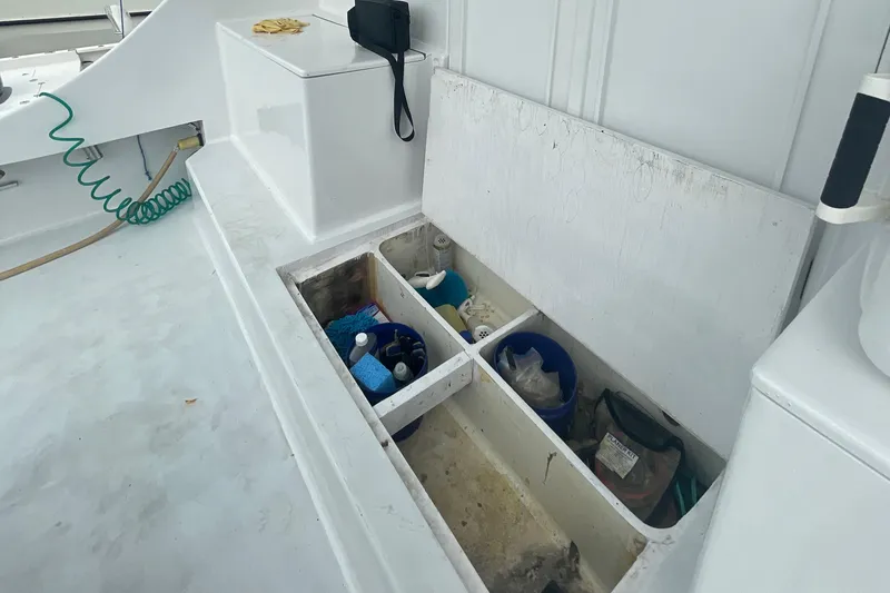 Slide: The Image of Storage compartment on 2004 Custom Carolina 47 Alex Willis boat deck. - 11