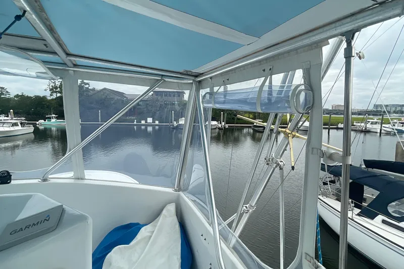 Slide: The Image of View from the 2004 Custom Carolina 47 Alex Willis boat docked at a marina. - 17