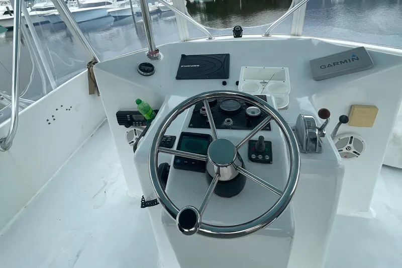 Slide: The Image of Helm of 2004 Custom Carolina 47 Alex Willis boat with Garmin navigation system. - 18