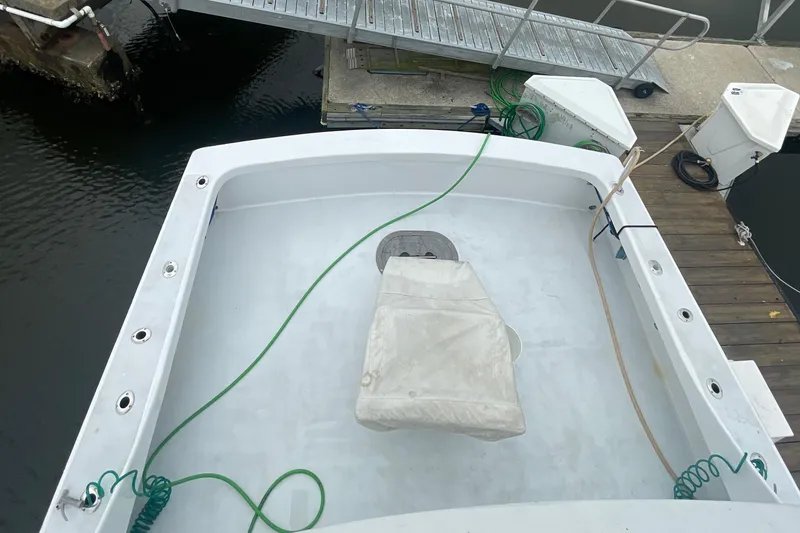 Slide: The Image of 2004 Custom Carolina 47 Alex Willis boat deck at dock. - 19