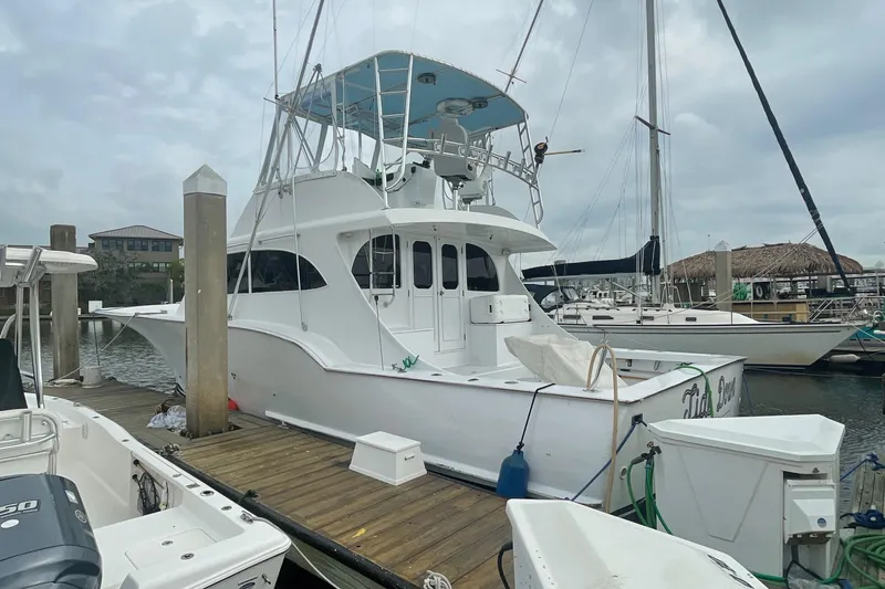 Slide: The Image of 2004 Custom Carolina 47 Alex Willis yacht docked at marina. - 3