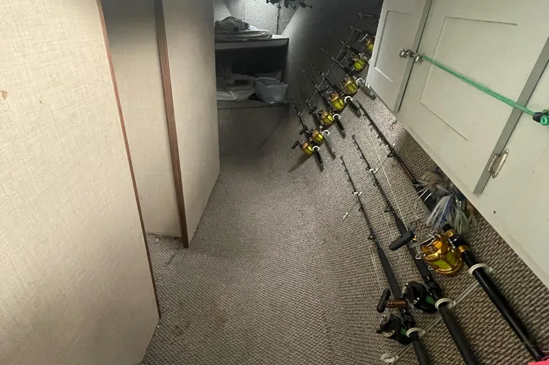 Slide: The Image of Fishing rod storage area on a 2004 Custom Carolina 47 Alex Willis boat. - 8
