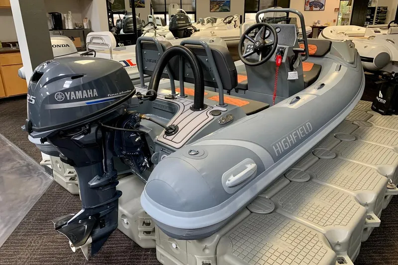 Slide: The Image of 2024 Highfield Sport 330 inflatable boat with Yamaha outboard motor in showroom. - 5