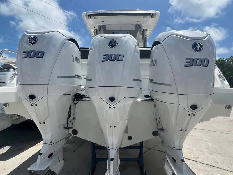 Slide: The Image of 2024 Jeanneau Leader 12.5 with triple Yamaha 300 outboard engines. - 5