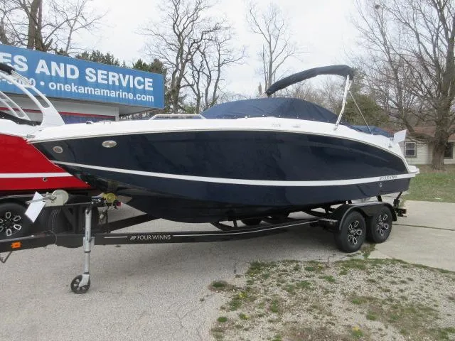 The Image of 2024 Four Winns HD3 boat on a trailer at a dealership. - 0