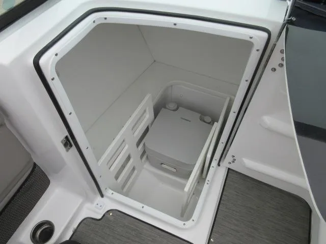Slide: The Image of 2024 Four Winns HD3 boat interior storage compartment. - 11