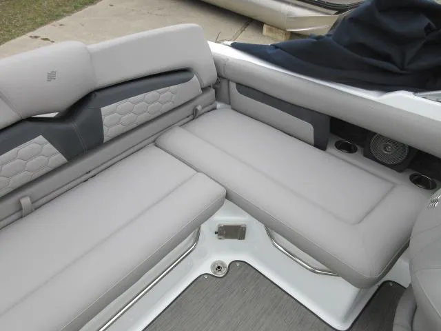 Slide: The Image of 2024 Four Winns HD3 boat interior with gray cushioned seating and modern design. - 13